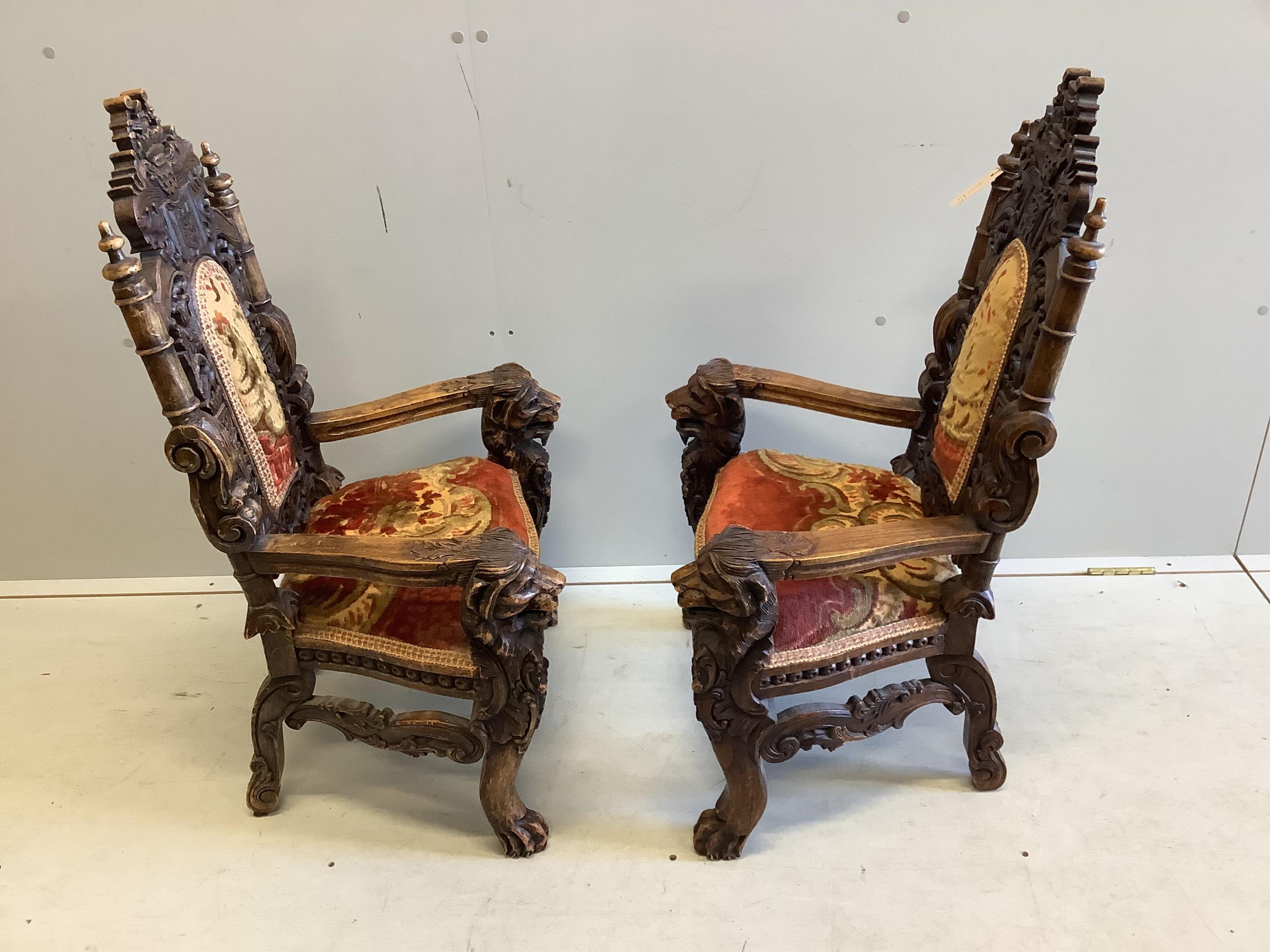 A near pair of 18th century style carved beech child's elbow chairs, larger width 55cm, depth 39cm, height 90cm. Condition - fair